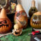 This shows several monster gourds carved with silly faces. They are waiting for me to make their custom hats.